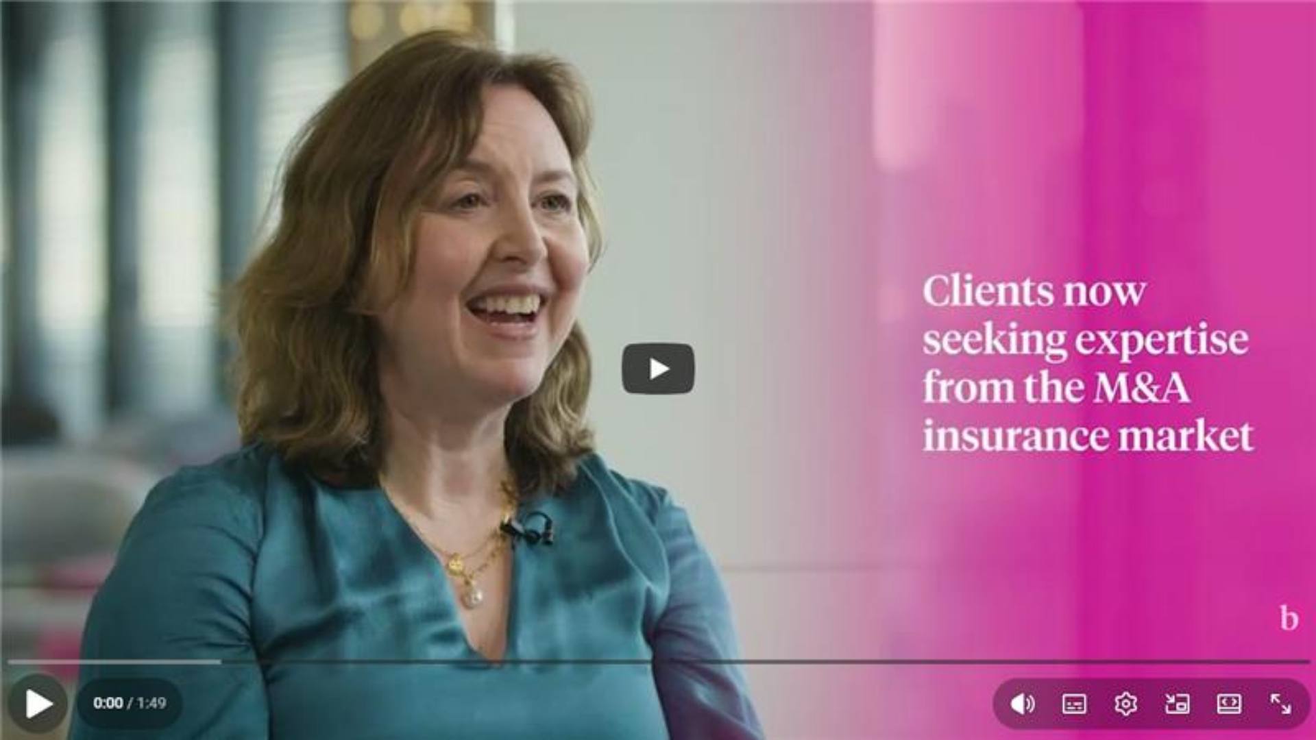 Lorraine Lloyd Thomas addresses the camera in a YouTube video discussing recent trends in the M&A market